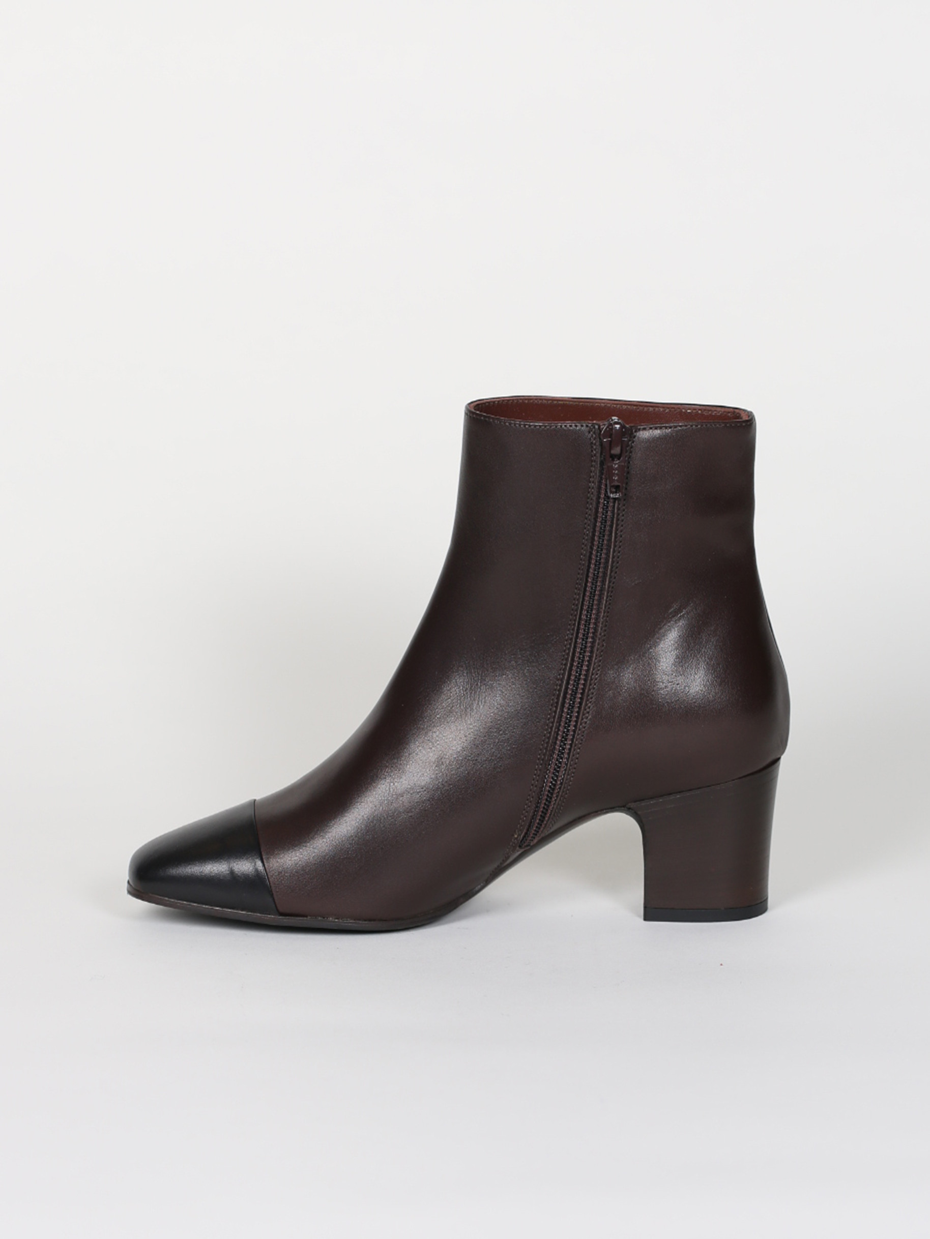 Black and brown leather low boots